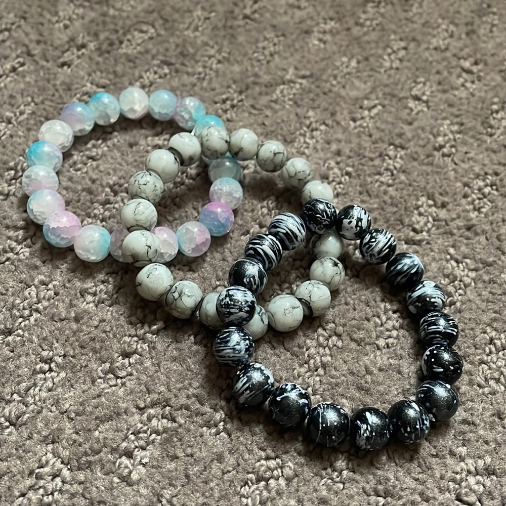 Blue and Pink bracelet, Black and White bracelet and a Marble bracelet.